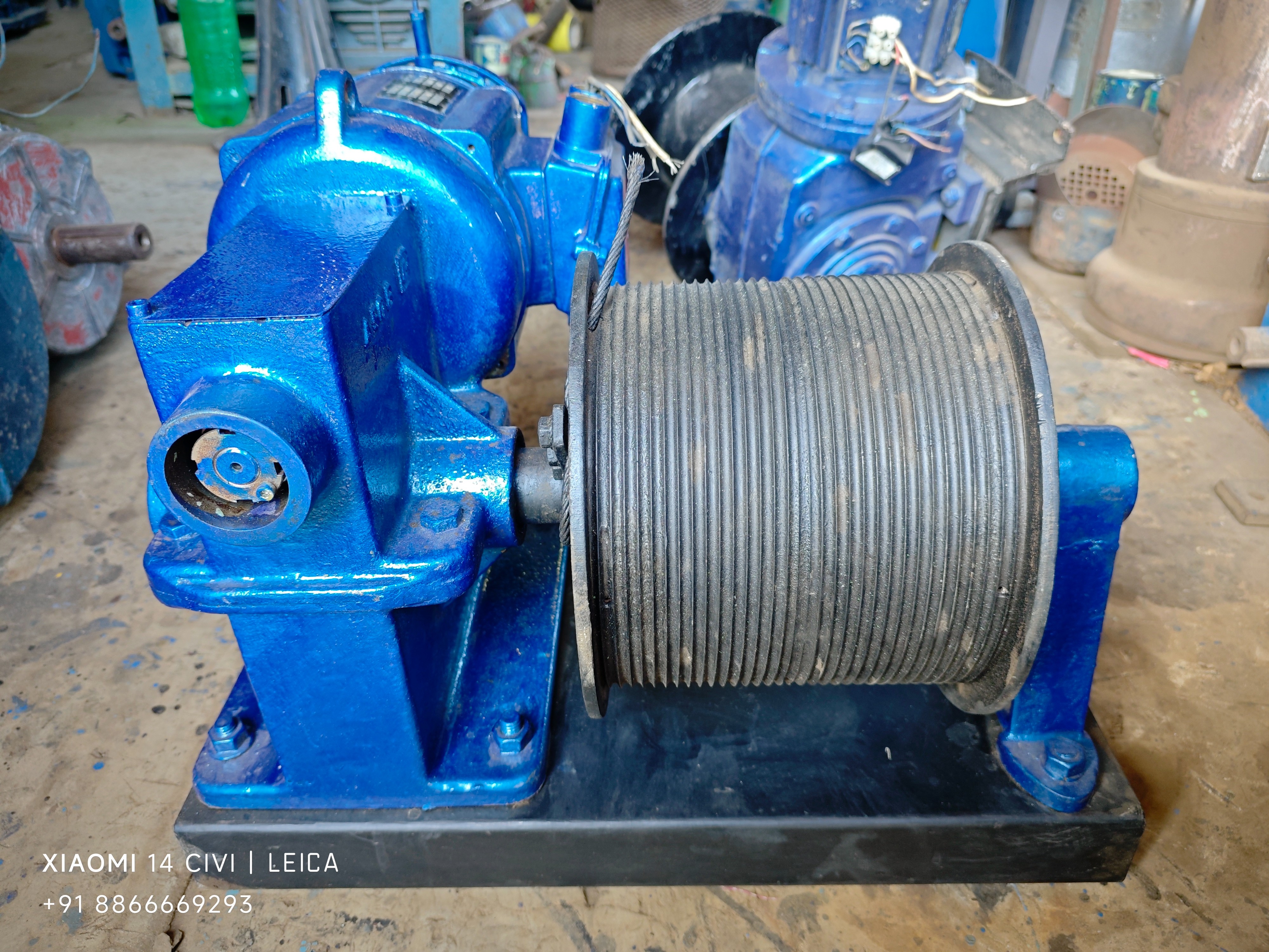2 HP 1.47 kW electric wire rope winch with blue motor, gearbox and grooved drum on black steel base, Standard Machinery