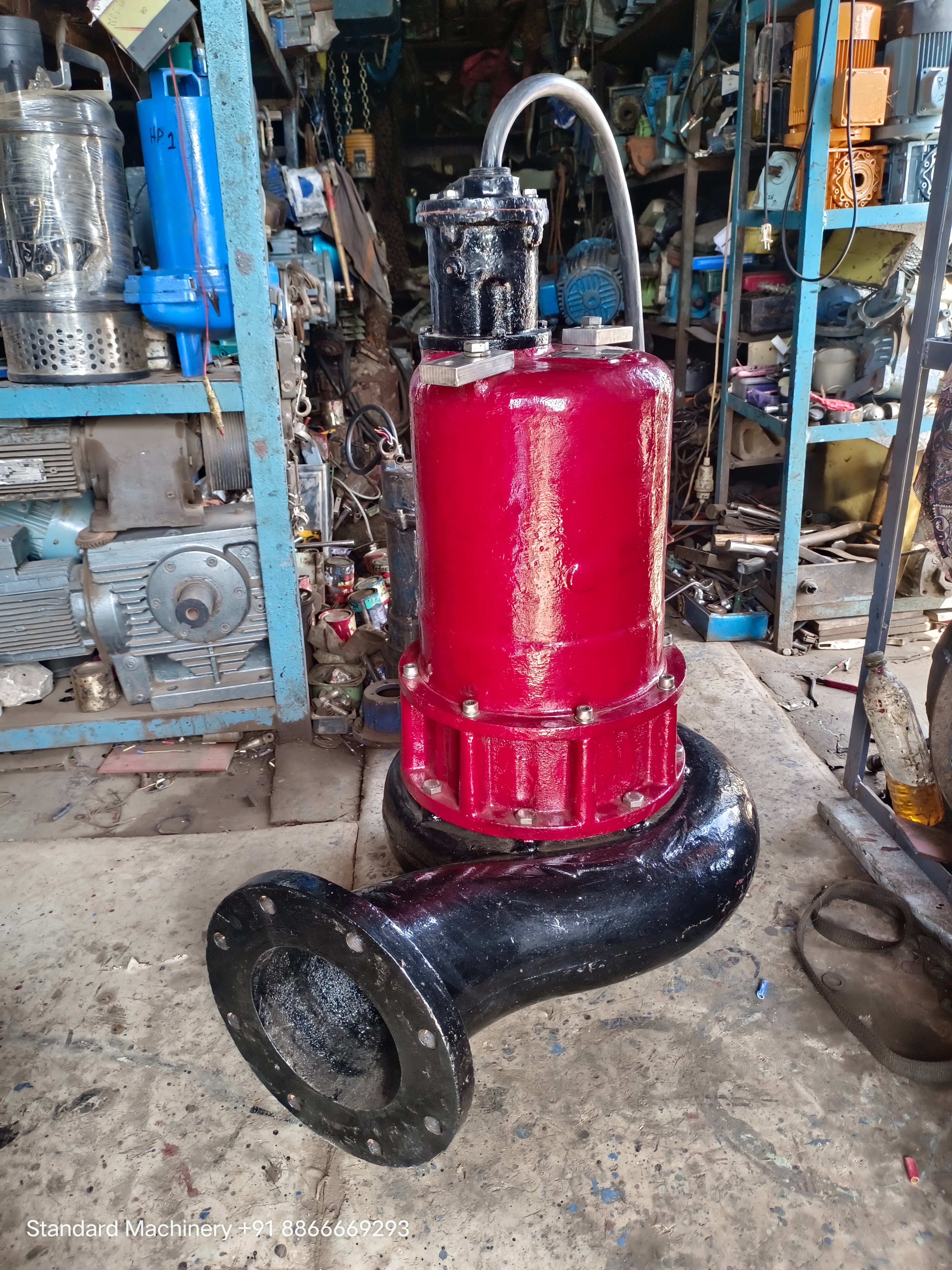 Pentair Hydromatic S8F 40 HP submersible sewage pump with red motor housing and black volute with flanged discharge, Standard Machinery