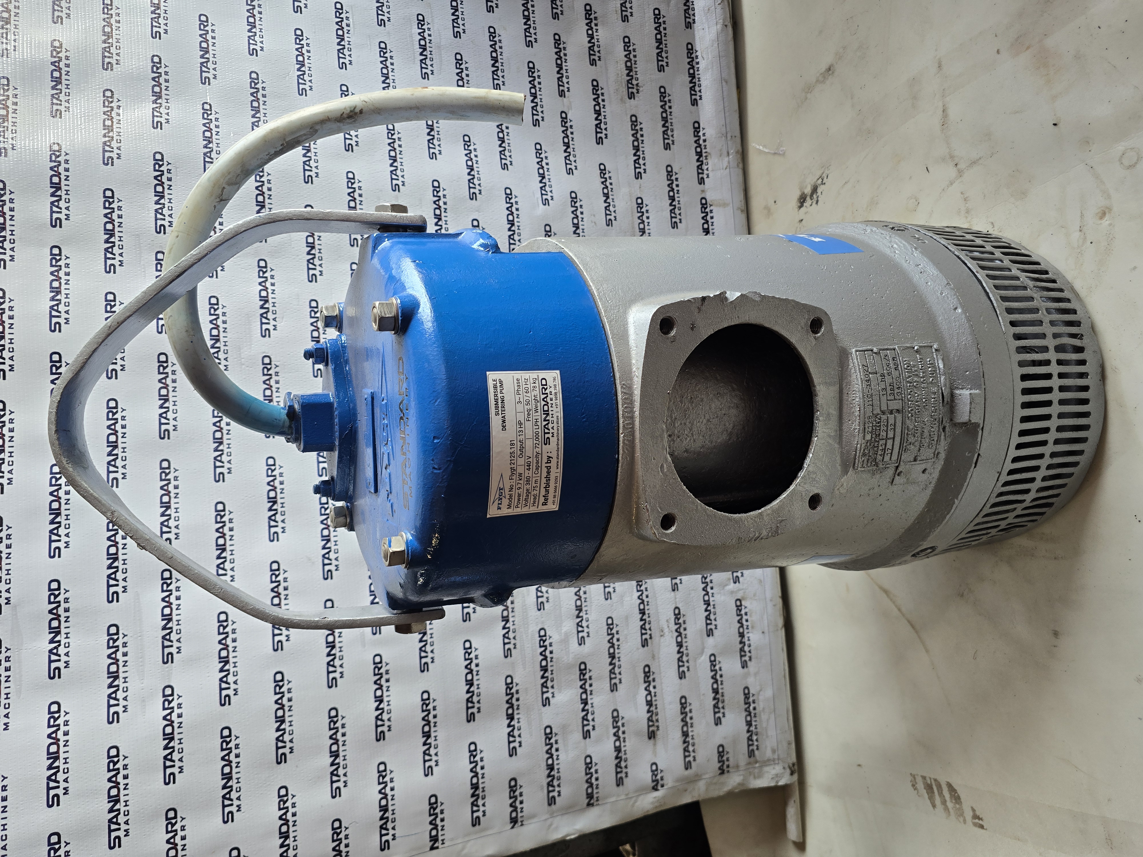 Flygt 2125 13 HP submersible dewatering pump with blue top cover, silver body, lifting handle and strainer, Standard Machinery