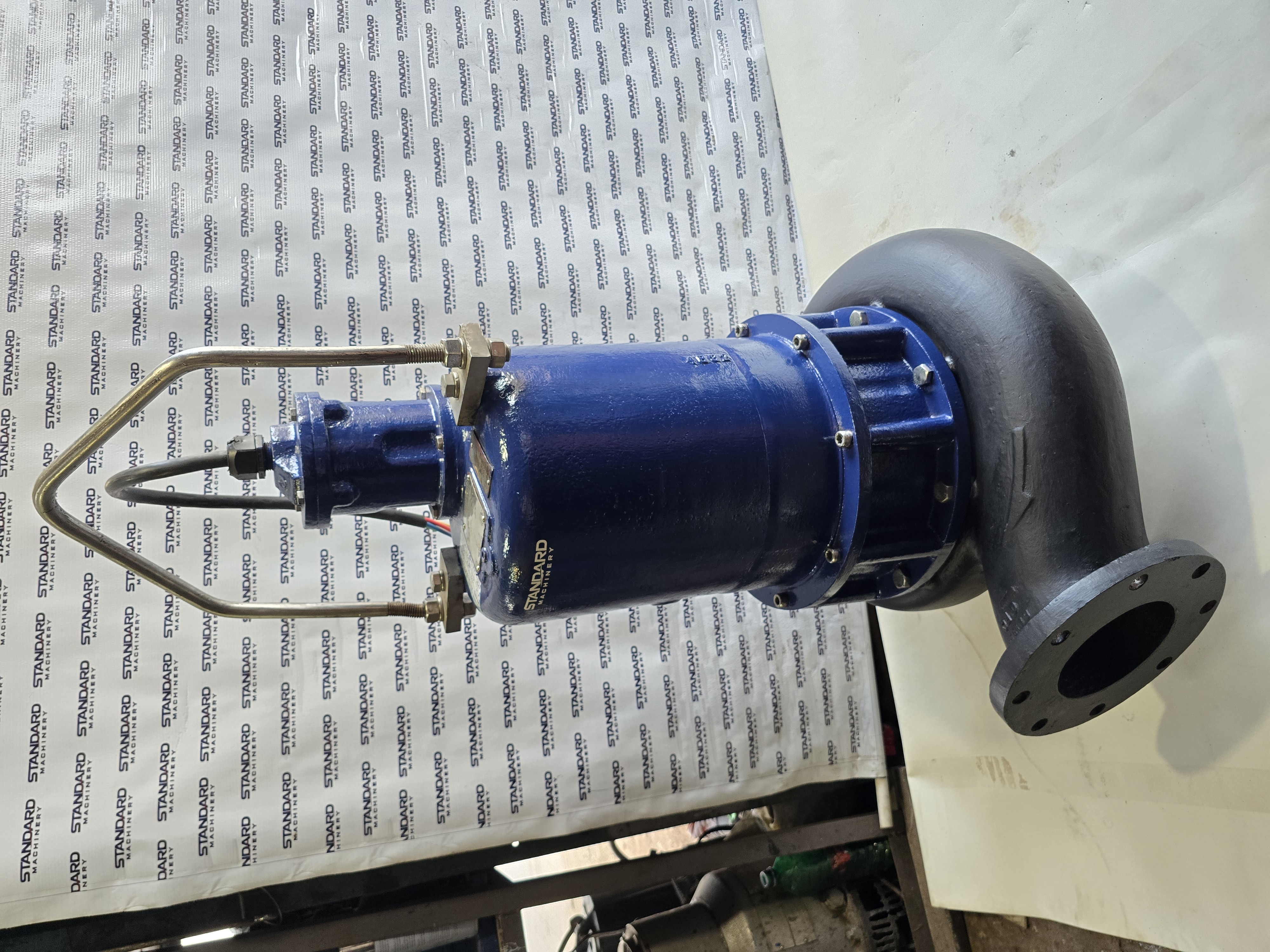 Hydromatic S6 30 HP submersible sewage pump with blue motor, black cast iron volute, 6 inch flanged outlet and brass lifting bail, Standard Machinery